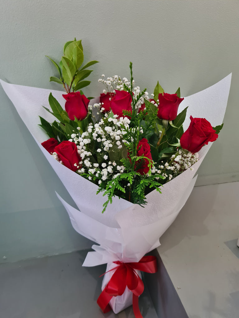 Long red roses in bouquet