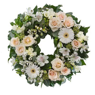 Sympathy flowers funeral wreath white cream blush flowers